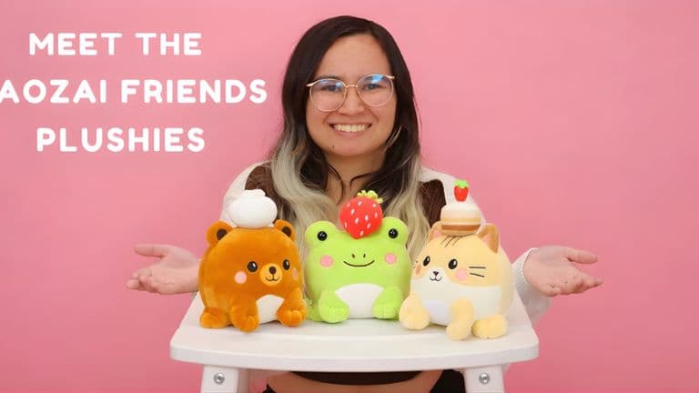 A woman poses with Baozai Friends plushies: a bear, frog, and cat with food toppings, representing creativity and compassion.