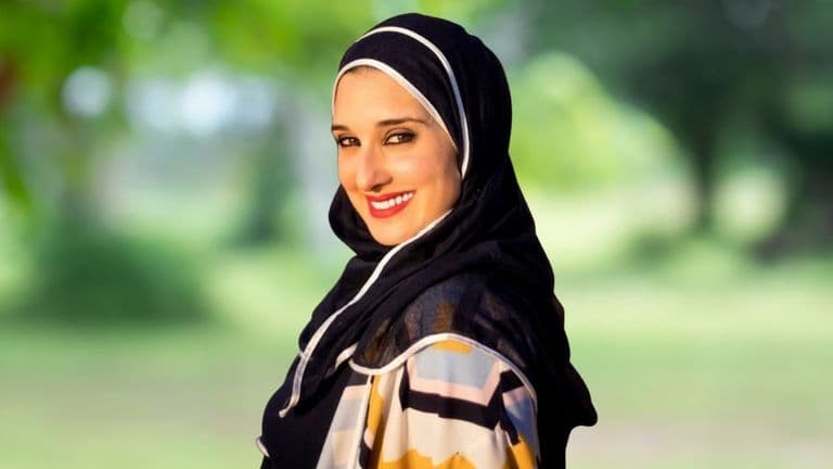 Vjolca Capri, trauma-focused therapist and founder of Total Wellness Clinic, specializing in trauma-informed care, smiling outdoors.