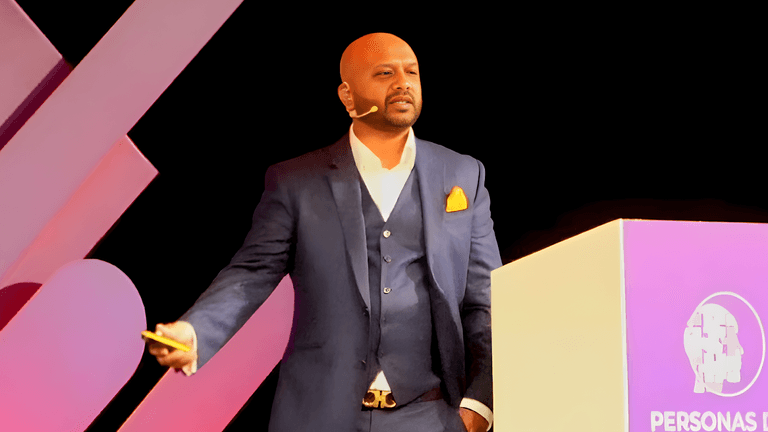 Jamal Ahmed delivering a keynote speech on empowering women in data privacy, showcasing leadership and expertise in the field.