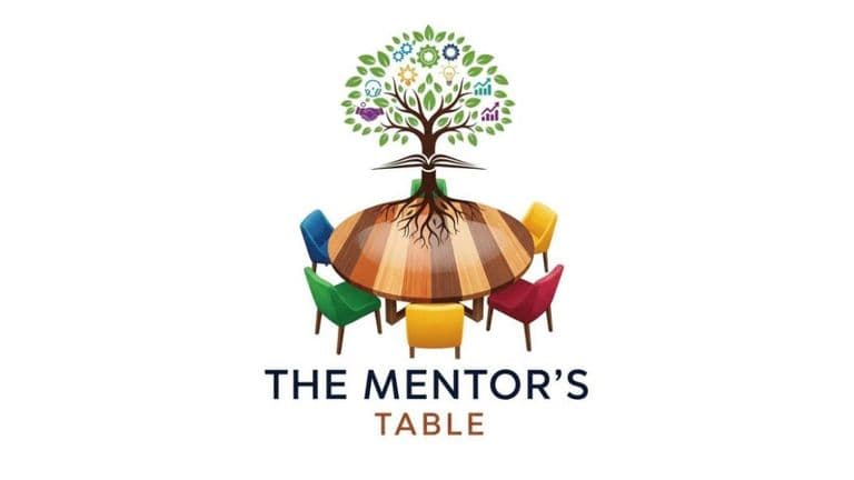 The image features a colorful tree symbolizing growth and success, with diverse chairs around a wooden table for mentorship.