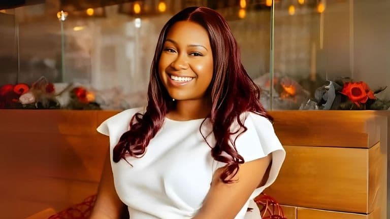 Ufeli Ani, founder of Gapeless Ltd, smiles confidently, representing the brand's mission to empower fuller-busted women in corporate fashion.