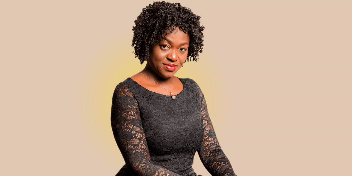 Eunice Atuejide, African woman in black lace dress, empowering high-achievers to reclaim clarity, purpose, and joy.