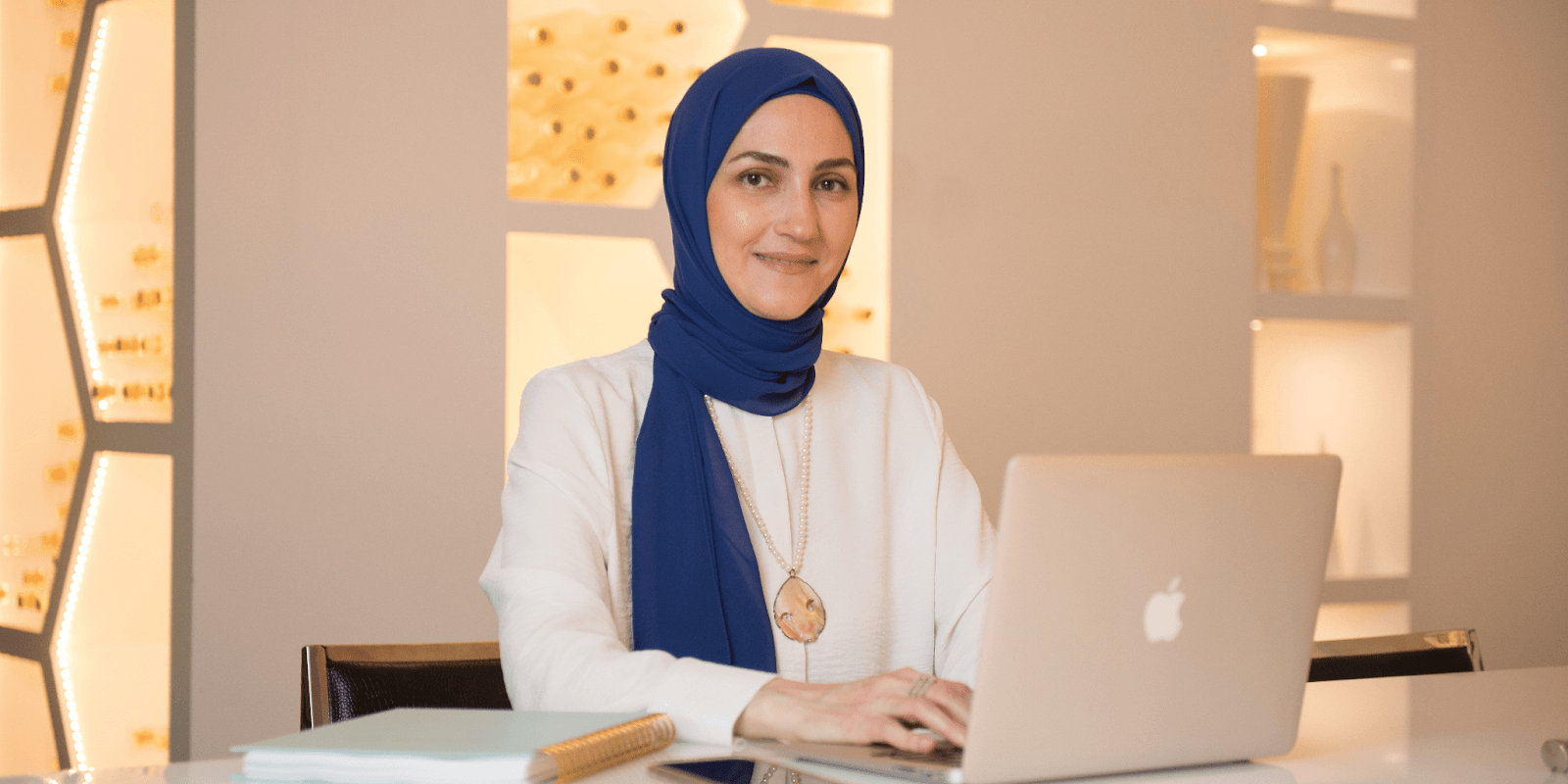 Rania Jaghlit, founder of Magna Empowerment, in a professional setting, empowering women to embrace authenticity and live purposefully.