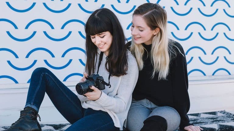 Charming Girlfriends Watching Photo Camera 23 2147762489
