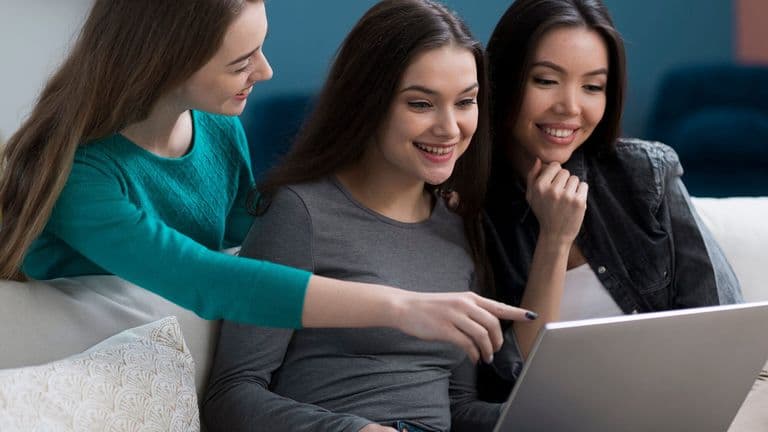 Close Up Adult Women Browsing Laptop Together 23 2148431638