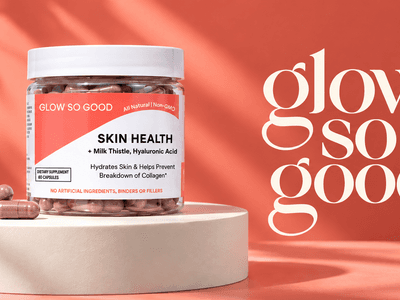 Container of skin health supplement with pills against a coral background and stylish text