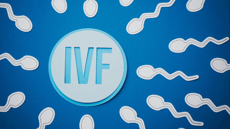 Illustration of sperm around a circular IVF emblem on a blue background