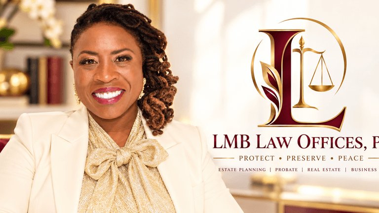 Smiling professional woman in a cream blazer posing in a law office setting