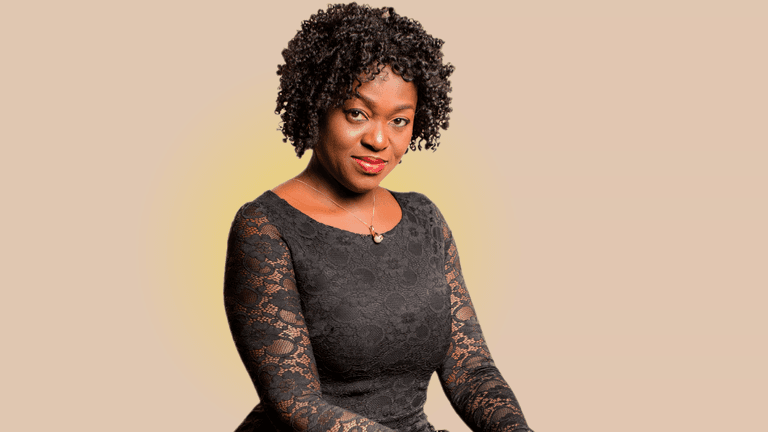 Eunice Atuejide, African woman in black lace dress, empowering high-achievers to reclaim clarity, purpose, and joy.