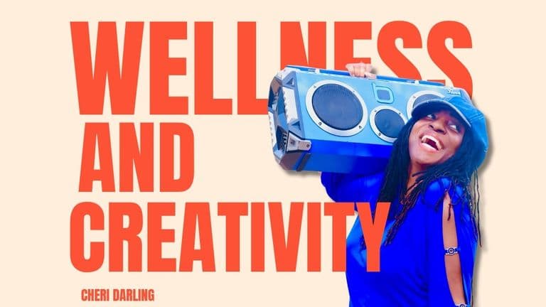 Image of Cheri Darling smiling while holding a blue boombox, symbolizing wellness, creativity, and self-care empowerment.