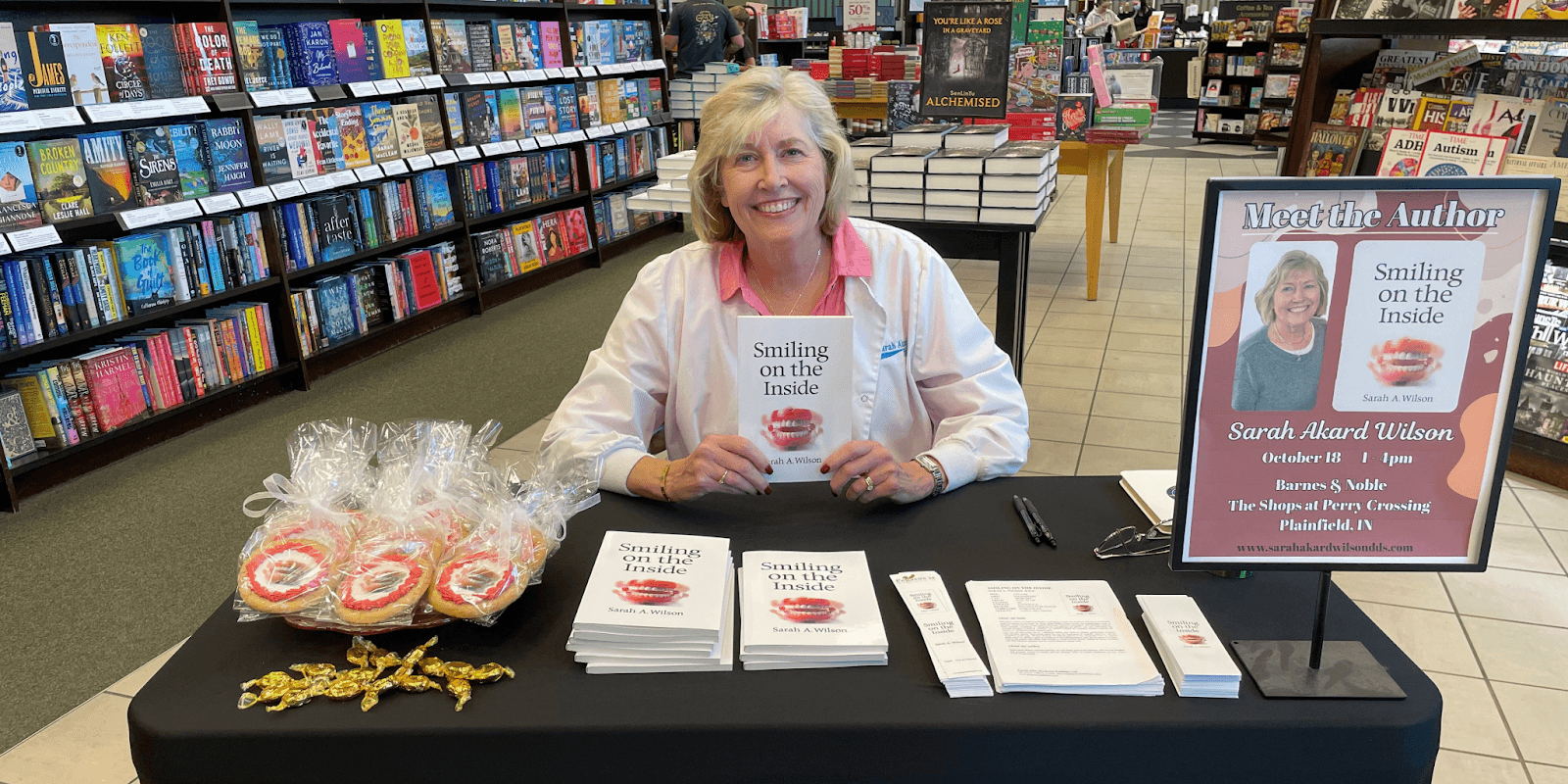 Dr. Sarah Wilson, author and dentist, smiling in a professional setting, showcasing her memoir "Smiling on the Inside".