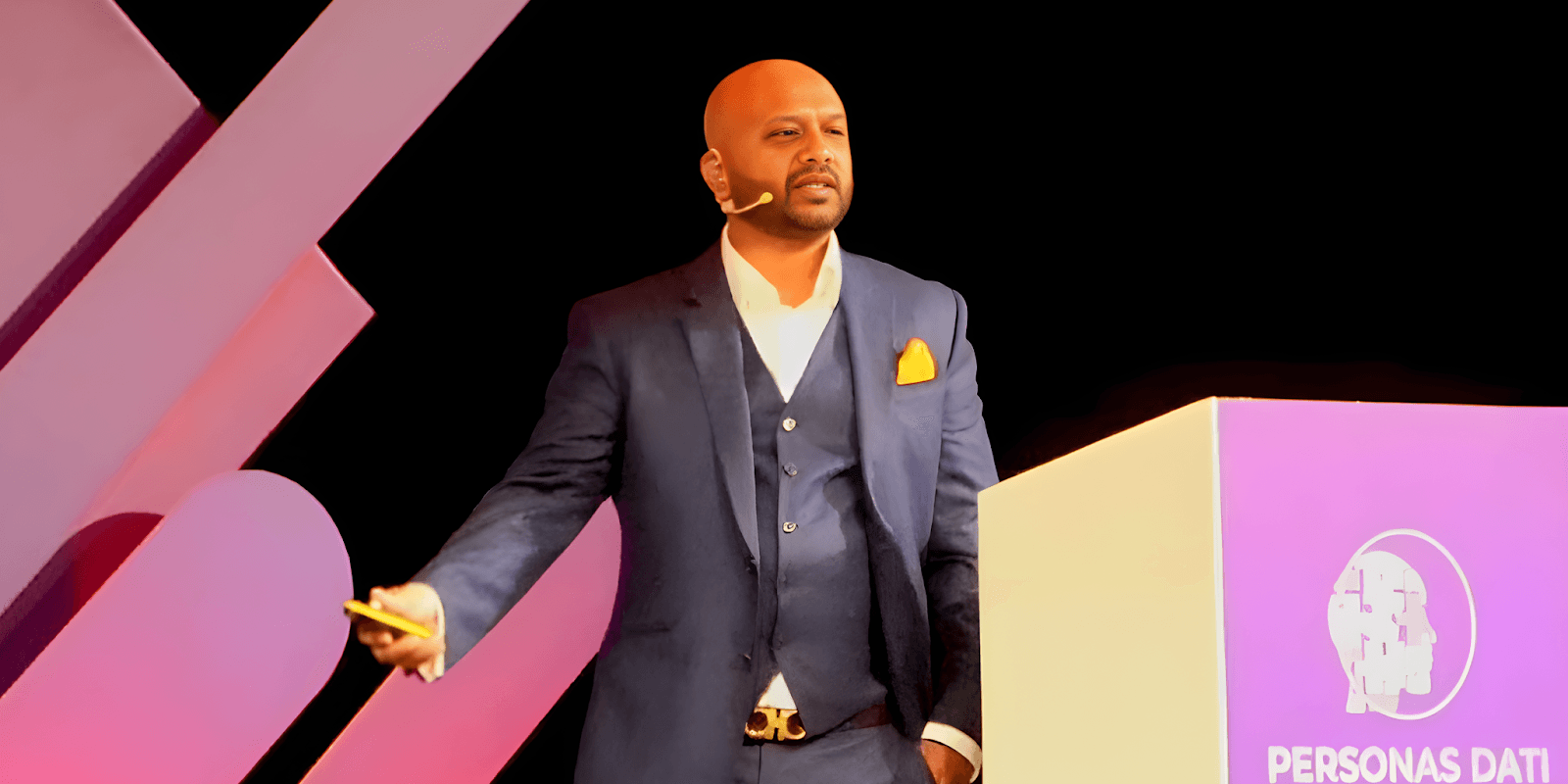 Jamal Ahmed delivering a keynote speech on empowering women in data privacy, showcasing leadership and expertise in the field.