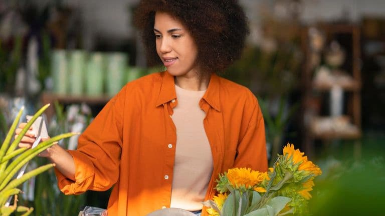 Medium Shot Woman With Beautiful Sunflowers 23 2150392040