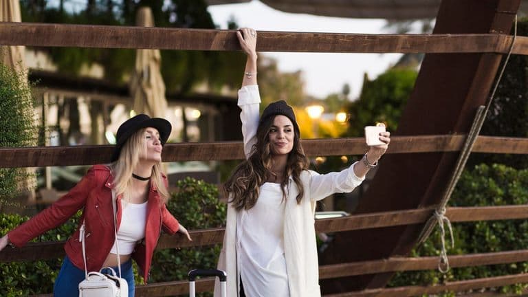 Women Taking Selfie Near Wooden Carcass 23 2147771331