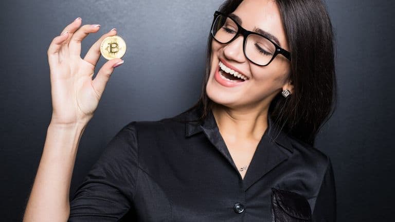 Young Successful Confident Woman With Glasses Holds Gold Bitcoin Her Hand Isolated Black Wall 231208 11713